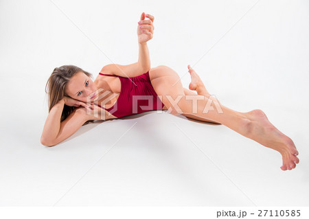 Young beautiful dancer in beige dress dancing on Young beautiful dancer in beige dress dancing on 27110585