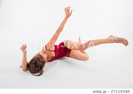 Young beautiful dancer in beige dress dancing on 27110590