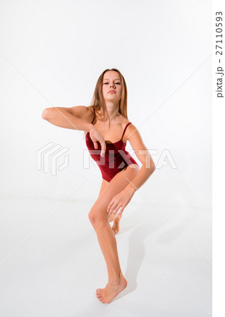 Young beautiful dancer in beige dress dancing on Young beautiful dancer in beige dress dancing on 27110593