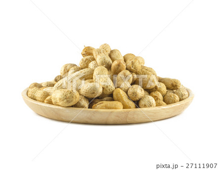 Dried peanuts in wood cup isolated on white Dried peanuts in wood cup isolated on white 27111907