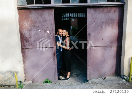 man and woman hugging in the doorway 27120139