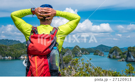 Traveler enjoy the View over Kabui Bay, Raja Ampat 27120913