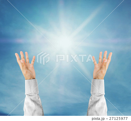 Hand trying to reach on the sky with sunshine rays 27125977