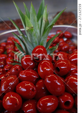 Red pitted Cerignola olives in oil close up 27132559