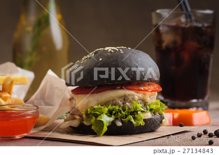 Trendy burger with beef in black bun Trendy burger with beef in black bun 27134843