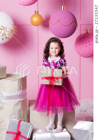 Brunette girl child 5 years old in a pink dress. Brunette girl child 5 years old in a pink dress. 27135547