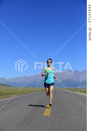 young fitness woman runner running on road young fitness woman runner running on road 27141834