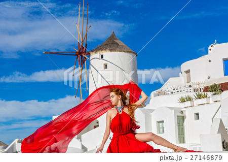 Beautiful woman in red dress on Santorini 27146879