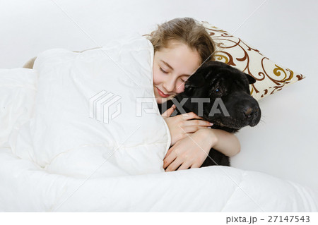 Teen girl sleeping with dog 27147543