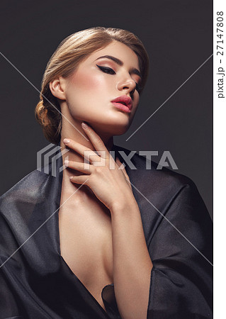 Beautiful girl with cat eye make-up Beautiful girl with cat eye make-up 27147808