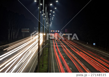 Speed Traffic - light trails on motorway at night. 27148535