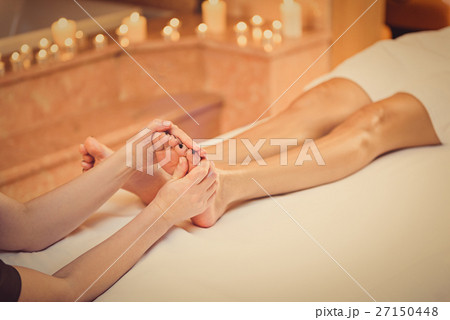 Young woman enjoying foot treatment Young woman enjoying foot treatment 27150448