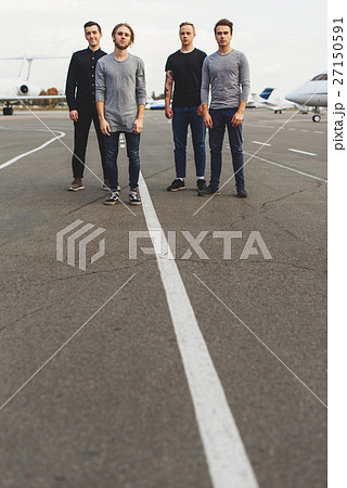 Confident four friends waiting for flight Confident four friends waiting for flight 27150591