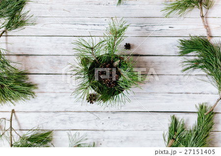 Christmas tree fir branches on wooden background Christmas tree fir branches on wooden background 27151405