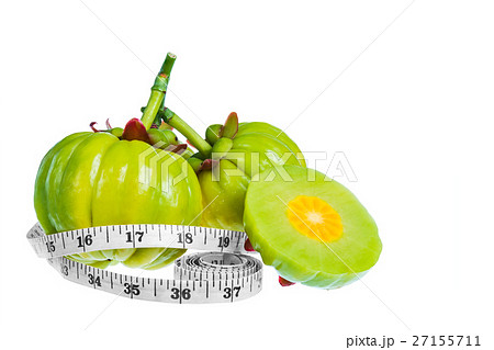 Garcinia cambogia fruit with tapeline, isolated 27155711