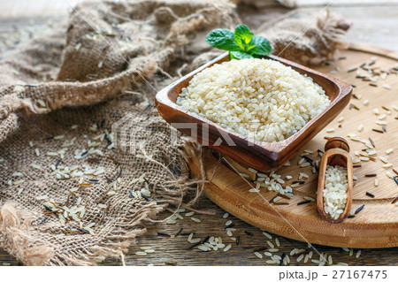 White round rice in a wooden bowl. White round rice in a wooden bowl. 27167475