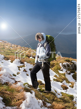 Young Woman hiking in the Mountains. Young Woman hiking in the Mountains. 27170874