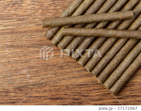 Cigarillo on wooden background 27172067