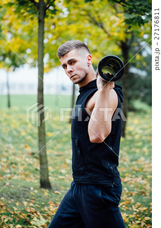 Male fitness doing exercise lunge with vipr 27176811