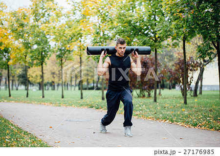 Male fitness doing exercise lunge with vipr Male fitness doing exercise lunge with vipr 27176985