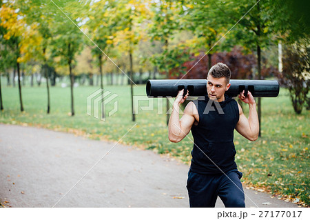 Male fitness doing exercise lunge with vipr Male fitness doing exercise lunge with vipr 27177017