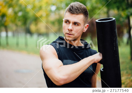 Male fitness doing exercise lunge with vipr 27177540