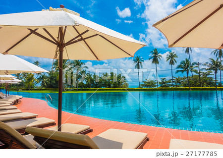 Umbrella and chair around swimming pool Umbrella and chair around swimming pool 27177785