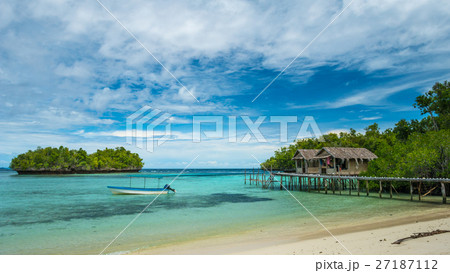 Beautiful Blue Lagoone with Bamboo Huts Raja Ampat Beautiful Blue Lagoone with Bamboo Huts Raja Ampat 27187112