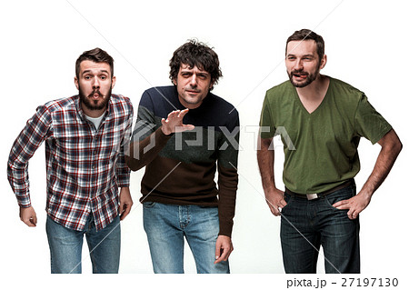 The three men are smiling, looking at camera 27197130