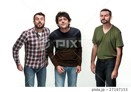 The three men are smiling, looking at camera 27197153