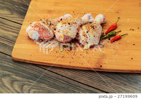 Raw chicken drumsticks with spices, peppers Raw chicken drumsticks with spices, peppers 27199609