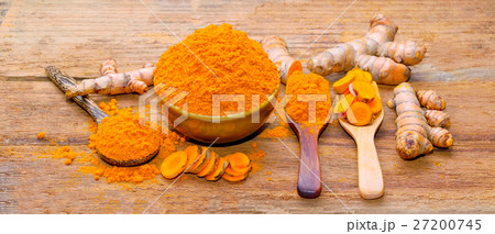 fresh turmeric roots on wooden table fresh turmeric roots on wooden table 27200745