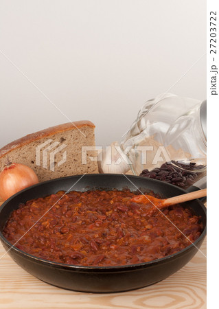 Chili Con Carne in pan on wooden table 27203722