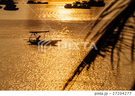 Asian fishing boats at sunset on a background of Asian fishing boats at sunset on a background of 27204277
