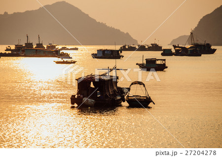 Asian fishing boats at sunset on a background of Asian fishing boats at sunset on a background of 27204278