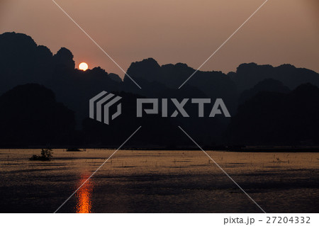 SUNSET over the forest. Glare on water, background SUNSET over the forest. Glare on water, background 27204332