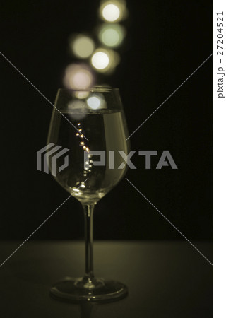 Glass of champagne with colored bubbles Glass of champagne with colored bubbles 27204521