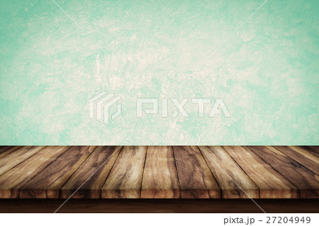 Empty wooden table with green wall background. 27204949