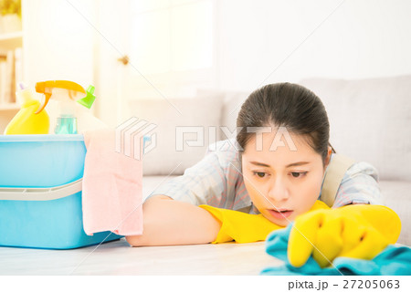 Tired woman holding rab with detergents 27205063