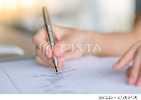 Business woman hand with Financial charts and laptop on the table . 27206750