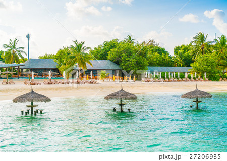 Beautiful tropical Maldives island with white sandy beach and sea . Beautiful tropical Maldives island with white sandy beach and sea . 27206935