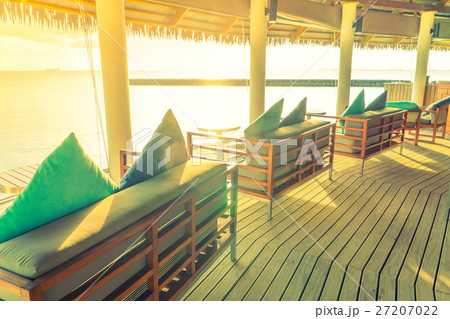 Vacation seat in tropical Maldives island and beauty of the sea with the coral reefs . ( Filtered image processed vintage effect. ) Vacation seat in tropical Maldives island and beauty of the sea with the coral reefs . ( Filtered image processed vintage effect. ) 27207022