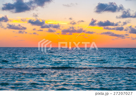 Beautiful sunset with sky over calm sea in tropical Maldives island 27207027