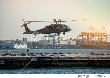 Military helicopter landing on heliport  27208970