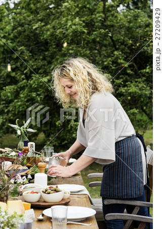 Woman Preparing Table Dinner Concept Woman Preparing Table Dinner Concept 27209429