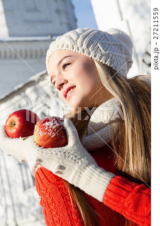 young girl in a sweater on a background of church young girl in a sweater on a background of church 27211559