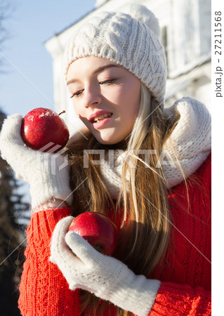 young girl in a sweater on a background of church young girl in a sweater on a background of church 27211568