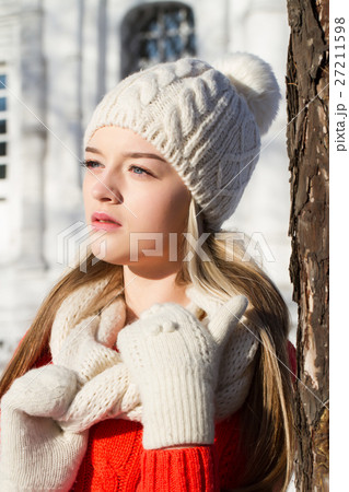 young girl in a sweater on a background of church young girl in a sweater on a background of church 27211598