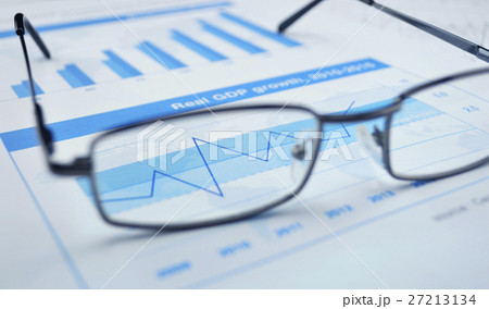 Glasses on financial chart and graph 27213134