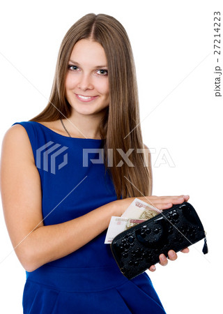 Portrait of happy girl in a blue dress, showing contents of purs Portrait of happy girl in a blue dress, showing contents of purs 27214223
